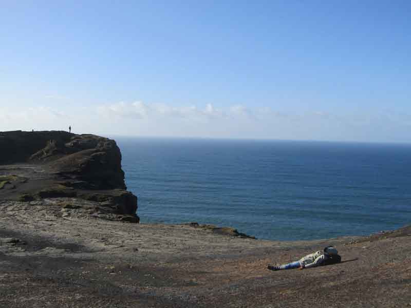 Tourist lying on the Cliffs