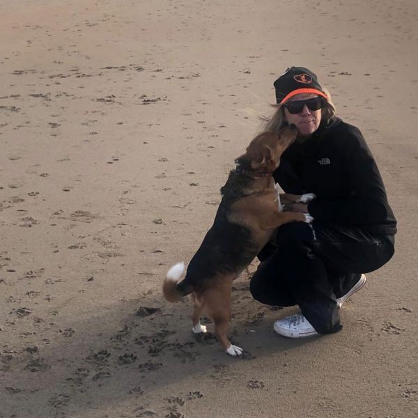 A woman in beanie with dog Moby